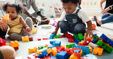 Toddlers playing with legos at a daycare