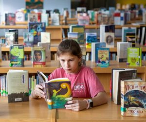 a child reading in a library