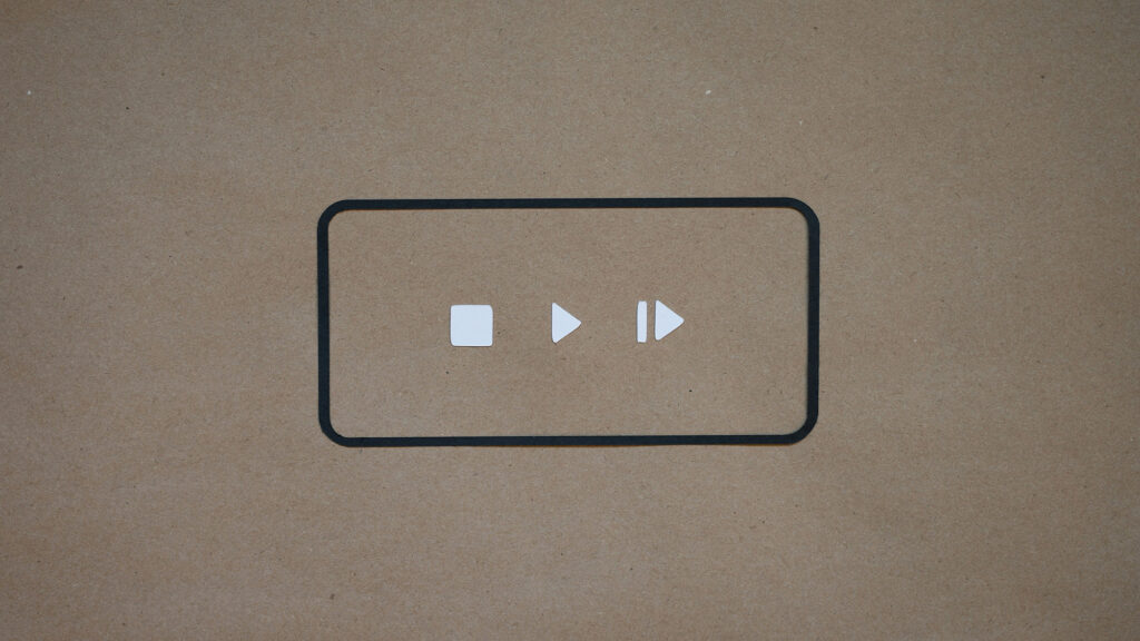 graphic of a video play button of white square, triangle and line/triangle combo inside a rectangle with dark border and rounded edges